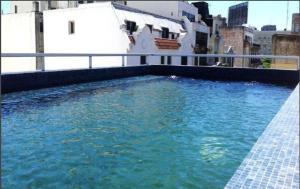 a swimming pool on the roof of a building at Buenos Aires Loft in Buenos Aires