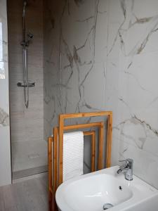 a bathroom with a sink and a mirror at B&B Tra mare e montagna - sauna e piscina in San Giorgio di Pesaro +36 photos