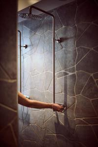 a shower stall with a towel hanging from the wall at Hotel Continental Relax & Spa in Halmstad