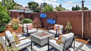 a patio with chairs and a fire pit in a backyard at Studio Mins to Culver City Downtown, Sony & Venice in Los Angeles