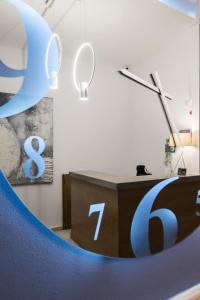 a desk with a blue logo on it in a room at Klimis Hotel in Spetses