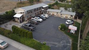 an aerial view of a parking lot in front of a house at City Centre Motel in Creston