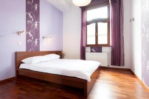 Posteľ alebo postele v izbe v ubytovaní DaVinci Radziwiłłowska Apartments