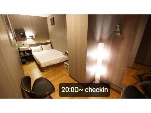 Postel nebo postele na pokoji v ubytování Petit Hotel mio