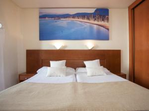 Postel nebo postele na pokoji v ubytování Magic Villa de Benidorm