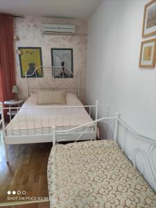 a bedroom with two beds in a room at Apartment Mira in Petrovac na Moru