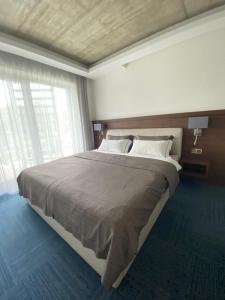 Säng eller sängar i ett rum på JBX Resort Apartments Lipno