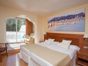 Postel nebo postele na pokoji v ubytování Magic Villa de Benidorm