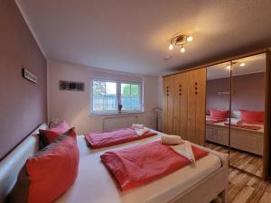 Ένα ή περισσότερα κρεβάτια σε δωμάτιο στο Ferienhaus Nici Wohneinheit Seehund