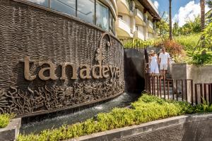 a group of people standing in front of a building at Tanadewa Resort Ubud Bali by Cross Collection in Ubud
