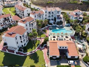an aerial view of a house with a swimming pool at Apartamentos El Bergantin Menorca Club in Fornells