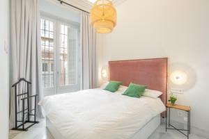 Posteľ alebo postele v izbe v ubytovaní Pinar Vip Class Malaga C/Granada