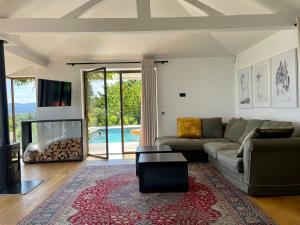 a living room with a couch and a fireplace at Villa The View in Koper