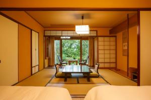 Cama ou camas em um quarto em Hakone Kowakien Mikawaya Ryokan