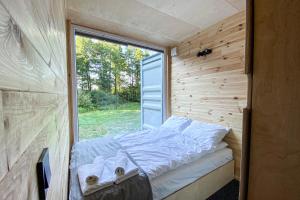 Postel nebo postele na pokoji v ubytování Arche Siedlisko Ujny