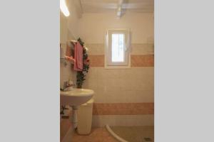 A bathroom at Seaside Villa Alexandra,Acharavi.