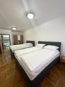 מיטה או מיטות בחדר ב-Apartman Erna