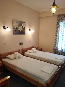 Postel nebo postele na pokoji v ubytování Hotel Faraggi