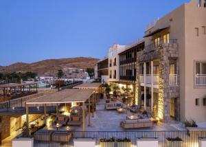 an exterior view of a building with a patio at Radisson Collection Hotel, Bodrum in Akyarlar