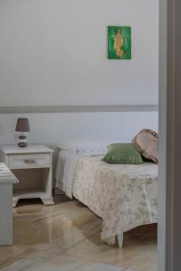 Posteľ alebo postele v izbe v ubytovaní Stabiaeflor Apartment