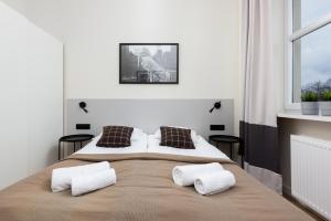 Posteľ alebo postele v izbe v ubytovaní Apartments Warsaw Gagarina by Noclegi Renters