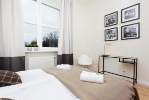 Posteľ alebo postele v izbe v ubytovaní Apartments Warsaw Gagarina by Noclegi Renters