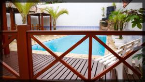 A piscina localizada em Pousada Recanto Bertioga ou nos arredores