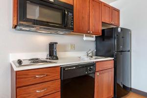 A kitchen or kitchenette at MainStay Suites