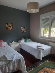 Postel nebo postele na pokoji v ubytování Casa Lola