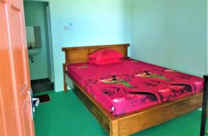 מיטה או מיטות בחדר ב-Kendang Kempul Hostel