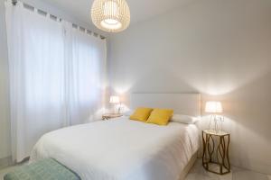 Posteľ alebo postele v izbe v ubytovaní Pinar Vip Class Malaga C/Alcazabilla