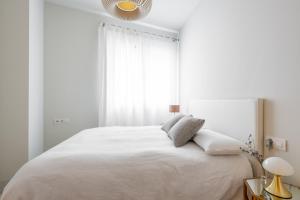 Posteľ alebo postele v izbe v ubytovaní Pinar Vip Class Malaga C/Alcazabilla