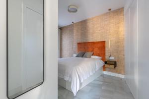 Posteľ alebo postele v izbe v ubytovaní Pinar Vip Class Malaga C/Alcazabilla