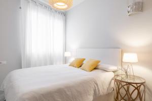 Posteľ alebo postele v izbe v ubytovaní Pinar Vip Class Malaga C/Alcazabilla