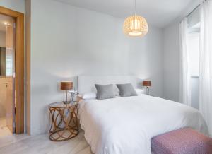 Posteľ alebo postele v izbe v ubytovaní Pinar Vip Class Malaga C/Alcazabilla