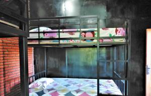 מיטה או מיטות בחדר ב-Kendang Kempul Hostel