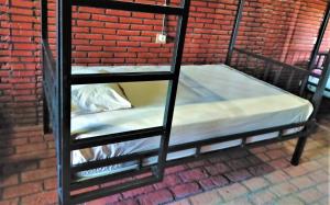 מיטה או מיטות בחדר ב-Kendang Kempul Hostel
