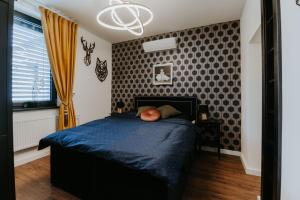 A bed or beds in a room at Apartmány Evia clinic