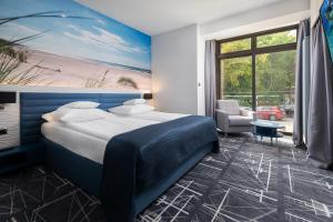 Posteľ alebo postele v izbe v ubytovaní Hotel Faleza - z widokiem na morze