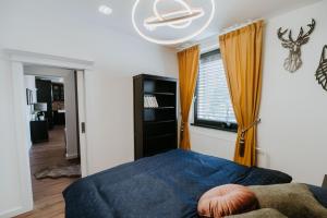 A bed or beds in a room at Apartmány Evia clinic
