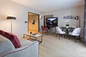 TV a/nebo společenská místnost v ubytování Citadines Eurometropole Strasbourg