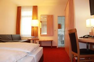 Postel nebo postele na pokoji v ubytování Hotel Hübler