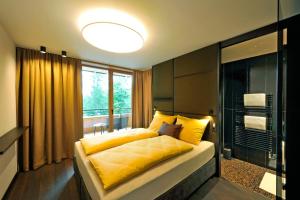 Letto o letti in una camera di Ferienparadies Natterer See
