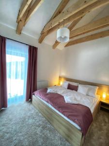 Postel nebo postele na pokoji v ubytování Apartments Severka - Jasná