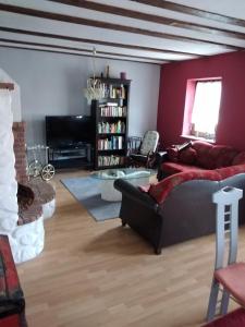 a living room with a couch and a fireplace at Ferienhaus Badetz in Badetz