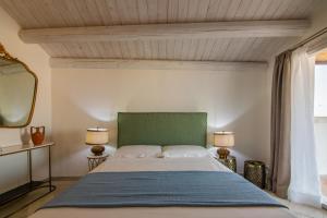 Lova arba lovos apgyvendinimo įstaigoje Terrazza Doxi Fontana