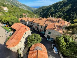 an aerial view of a building with a parking lot at Castillon - Maritime Alpes in Castillon