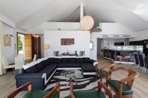 a living room with a couch and a table at Villa Flamingos Marbella in Marbella