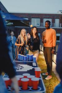 a group of people standing around a table with cups on it at CAB20 in Hamburg