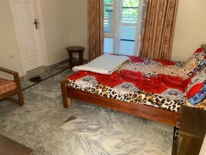a bedroom with a bed in a room at Shah Family Guest House in Swat
